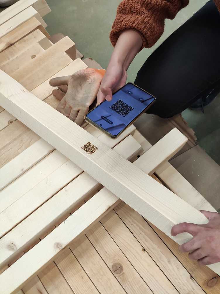 (iv) QR-codes laser engraved into the timber beams for material tracking
